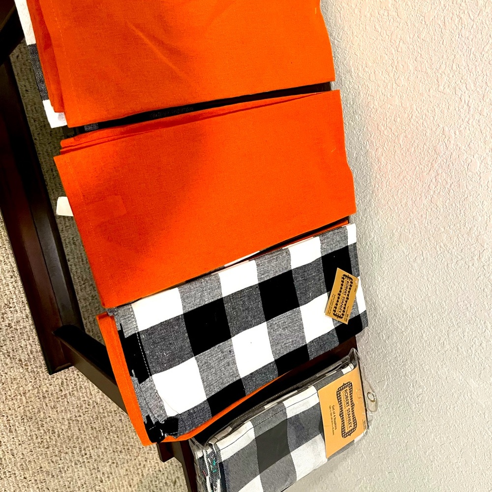 Selling unique kitchen towels (new) orange and black and white towels plaid